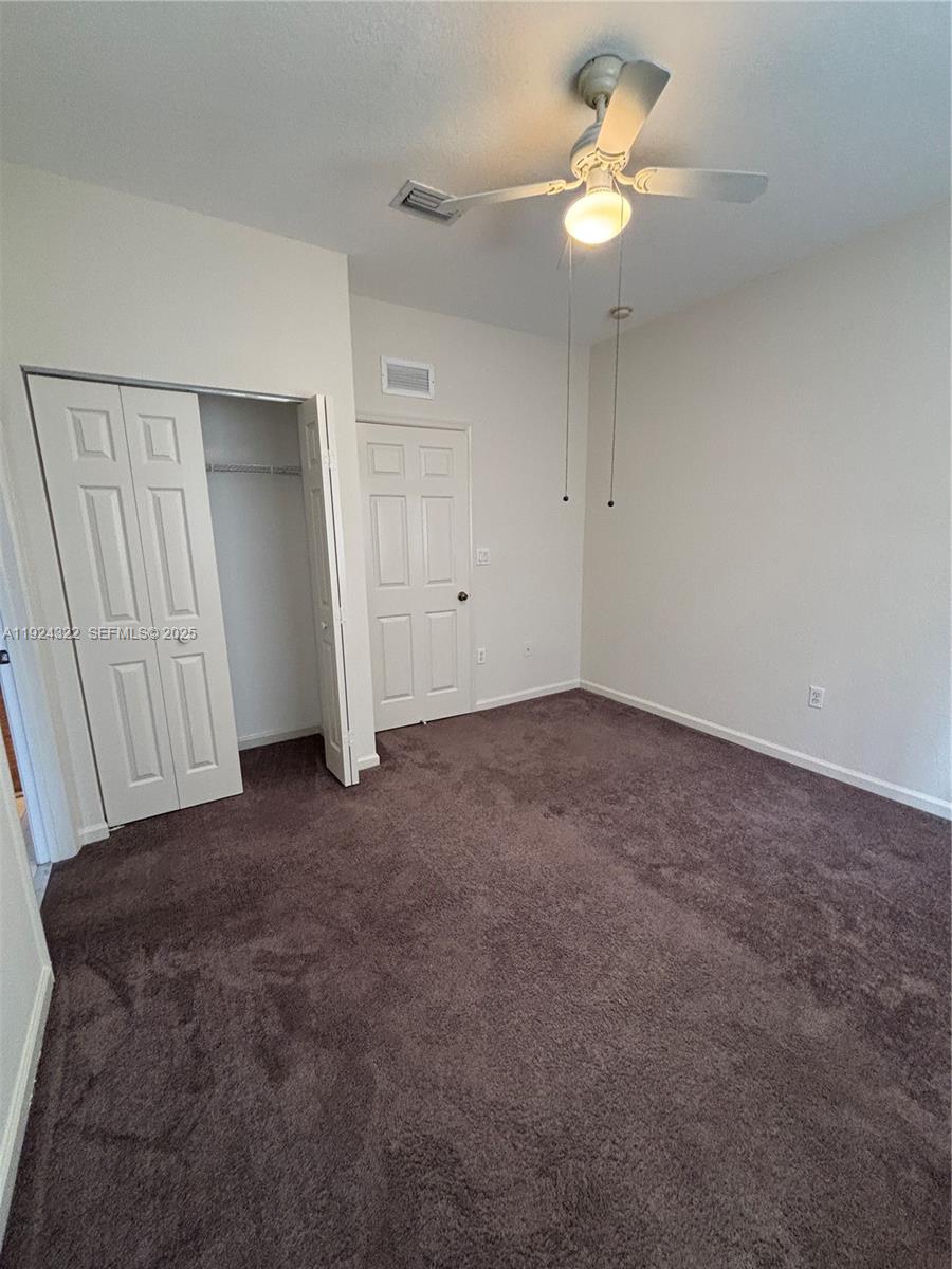 6533 Catalina Lane, Unit 6533 Tamarac, FL 33321 - Photo 19 of 27 wooden floor in an empty room