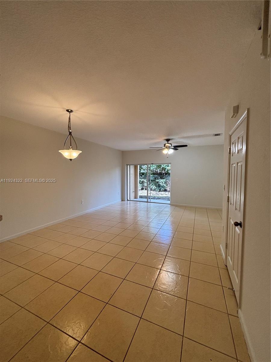 6533 Catalina Lane, Unit 6533 Tamarac, FL 33321 - Photo 2 of 27 a view of a livingroom with a staircase