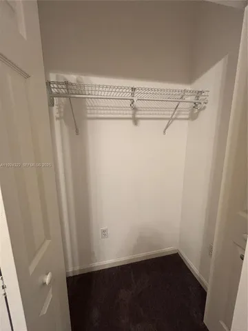 a view of a room with racks on the wall