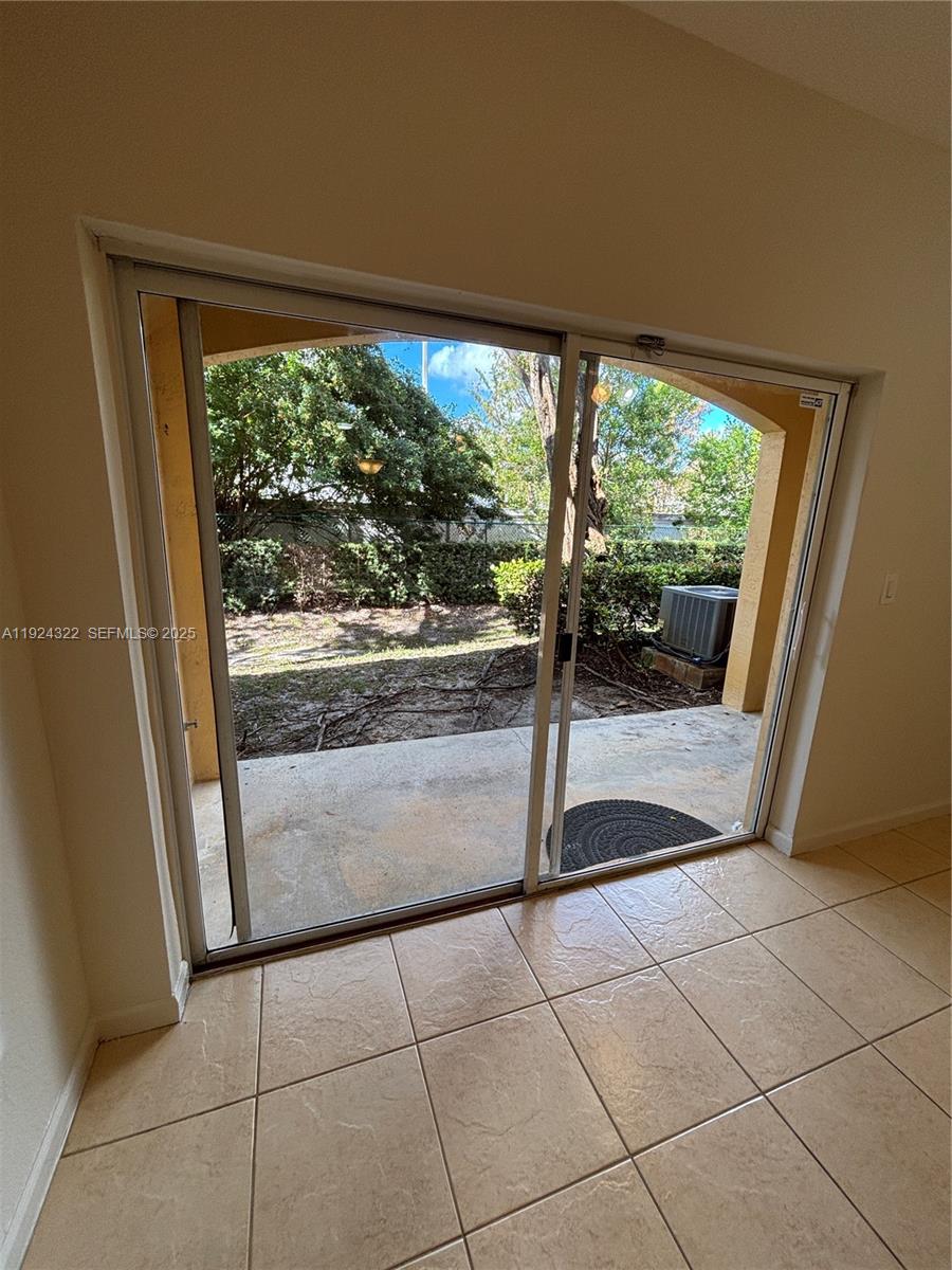 6533 Catalina Lane, Unit 6533 Tamarac, FL 33321 - Photo 4 of 27 a view of a room that has a large window