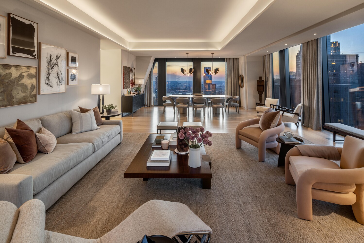 53 West 53rd Street, Unit 54A Manhattan, NY 10019 - Photo 4 of 14 a living room with furniture and a large window