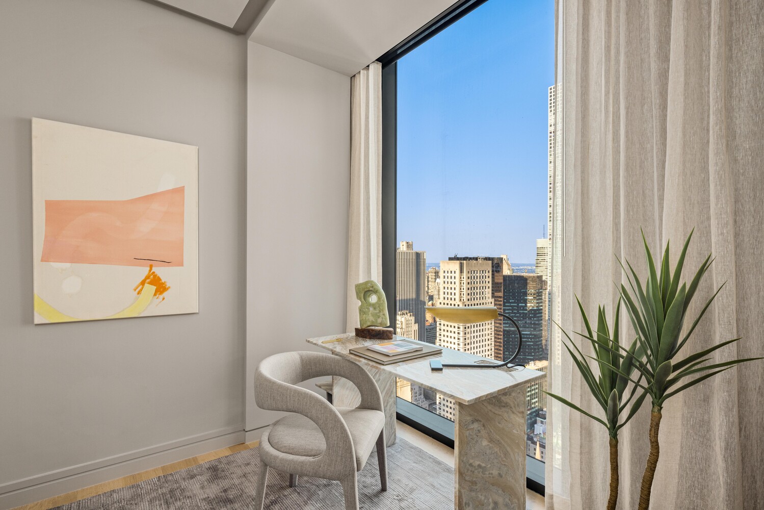 53 West 53rd Street, Unit 54A Manhattan, NY 10019 - Photo 6 of 14 a workspace with furniture and a window