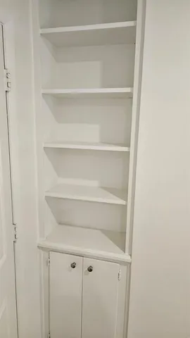 a view of an empty walk in closet