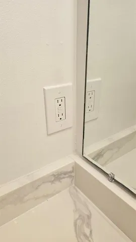 a view of a bathroom with bathtub