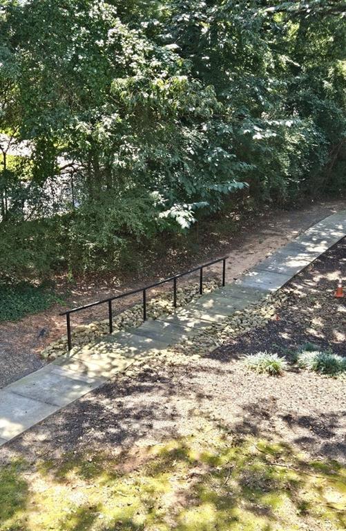 1150 Collier Road Northwest, Unit K12 Atlanta, GA 30318 - Photo 27 of 32 a view of a tree in the middle of a yard