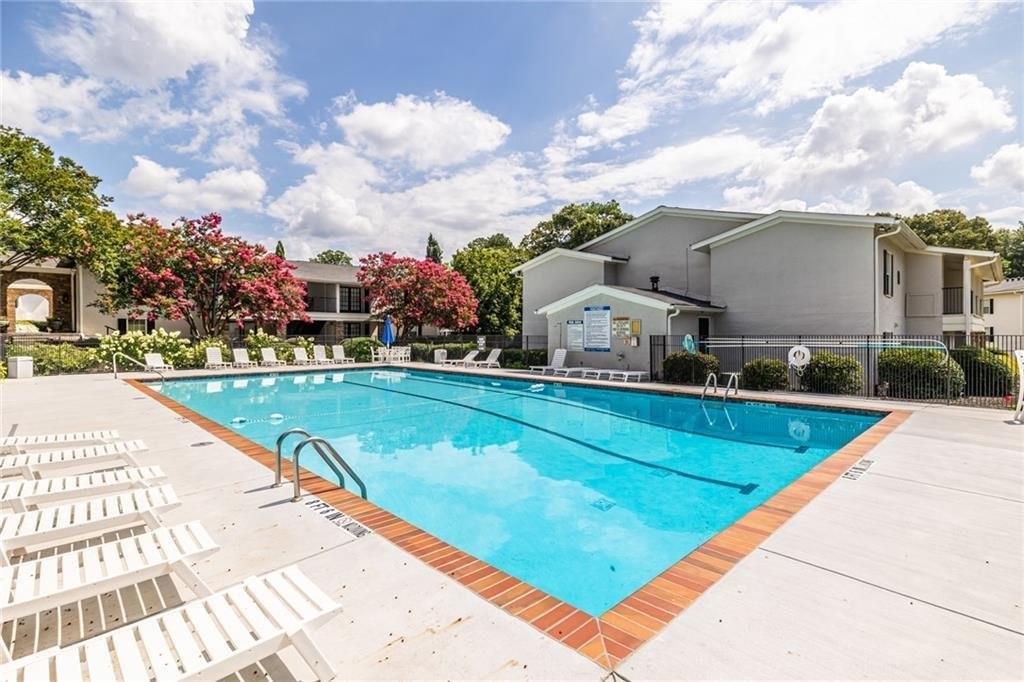 1150 Collier Road Northwest, Unit K12 Atlanta, GA 30318 - Photo 29 of 32 a view of swimming pool is middle in the garden