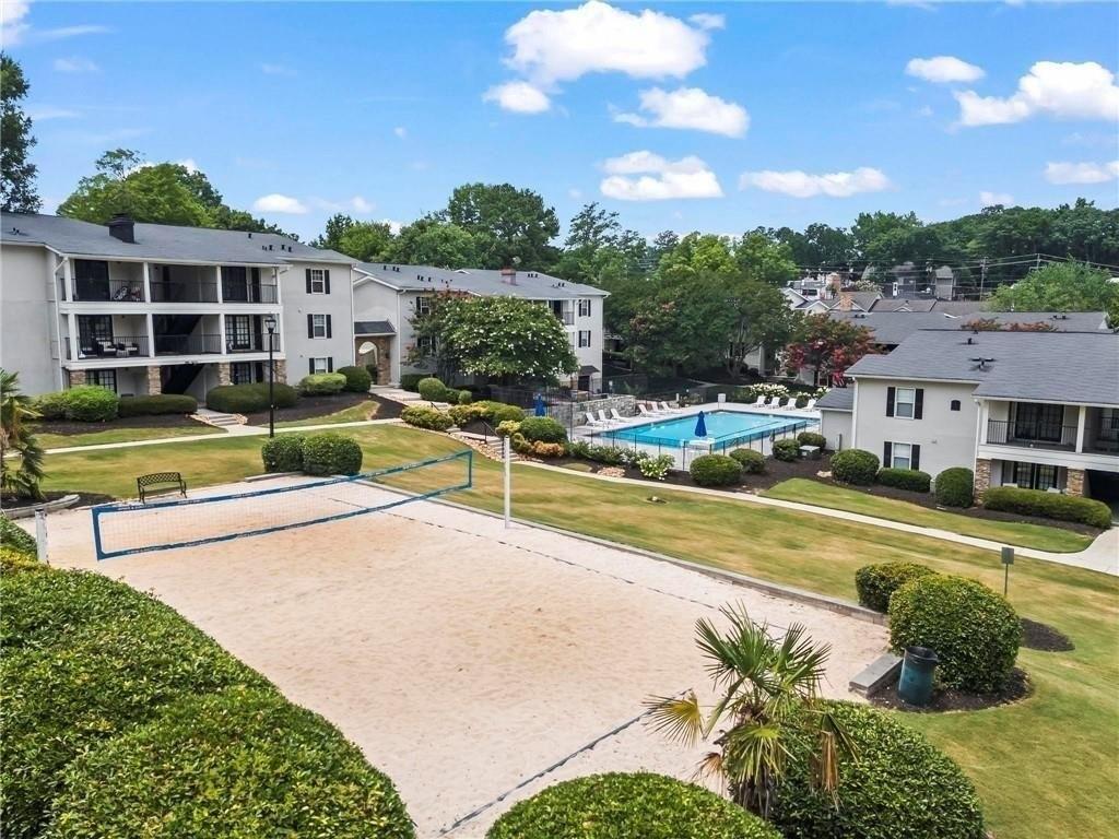 1150 Collier Road Northwest, Unit K12 Atlanta, GA 30318 - Photo 31 of 32 a view of an house with a swimming pool