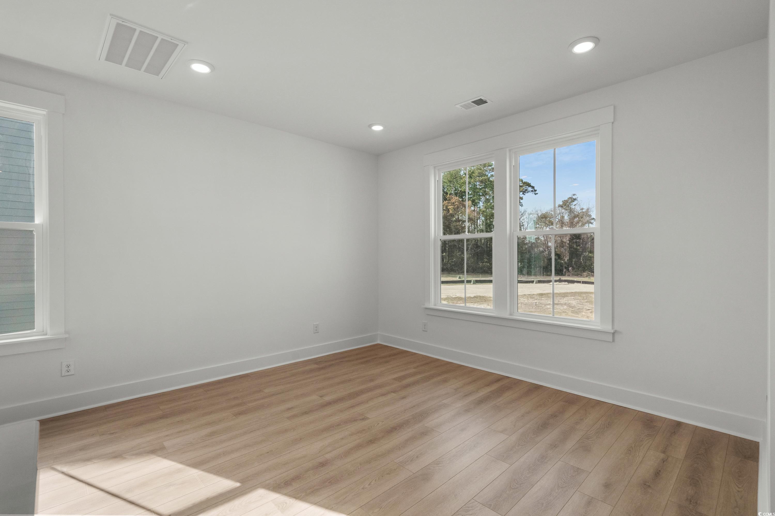 4414 Kingsport Road, Unit 1402 Little River, SC 29566 - Photo 10 of 34 Empty room featuring light wood-style flooring and recessed lighting