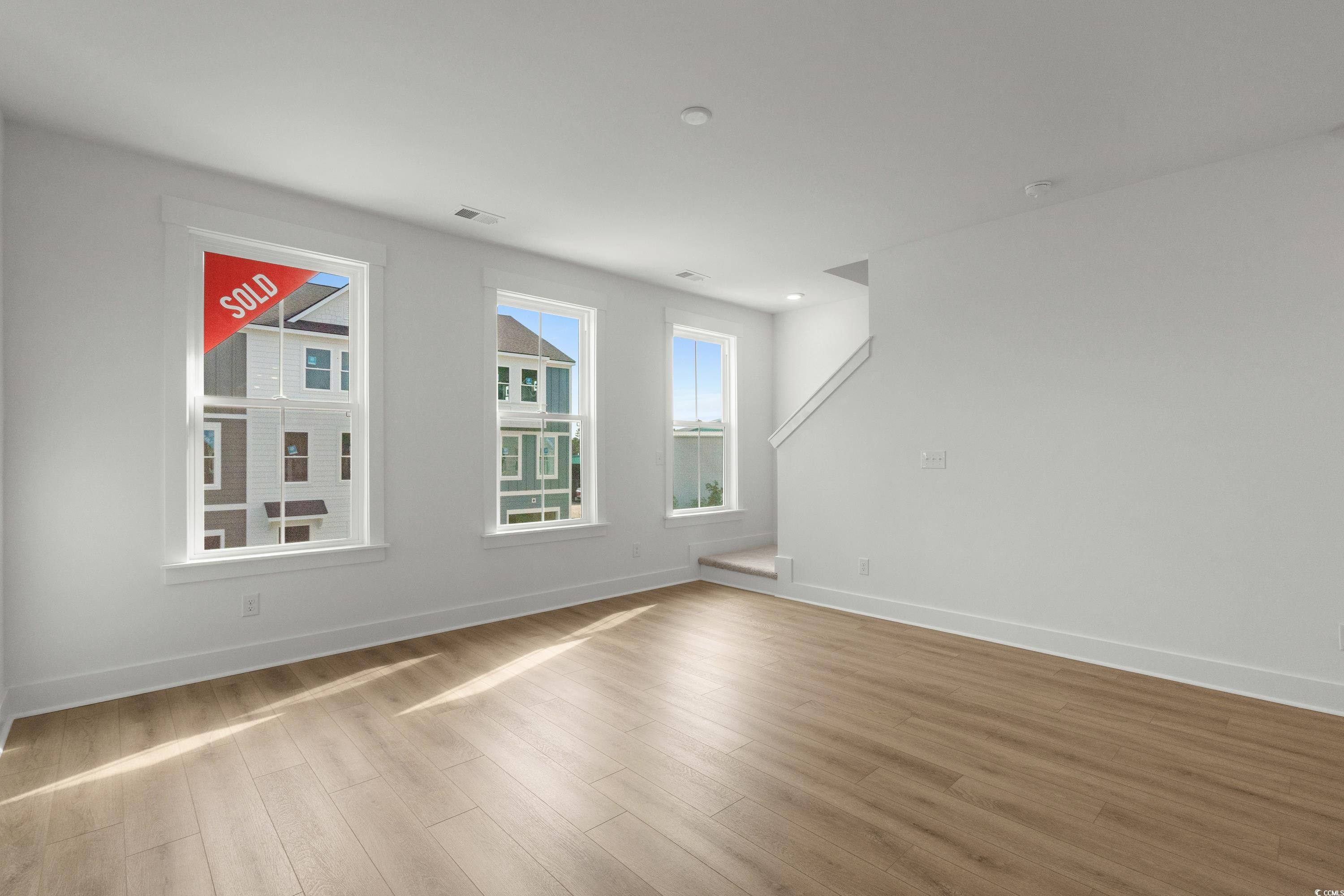 4414 Kingsport Road, Unit 1402 Little River, SC 29566 - Photo 13 of 34 Spare room with light wood-style floors and baseboards