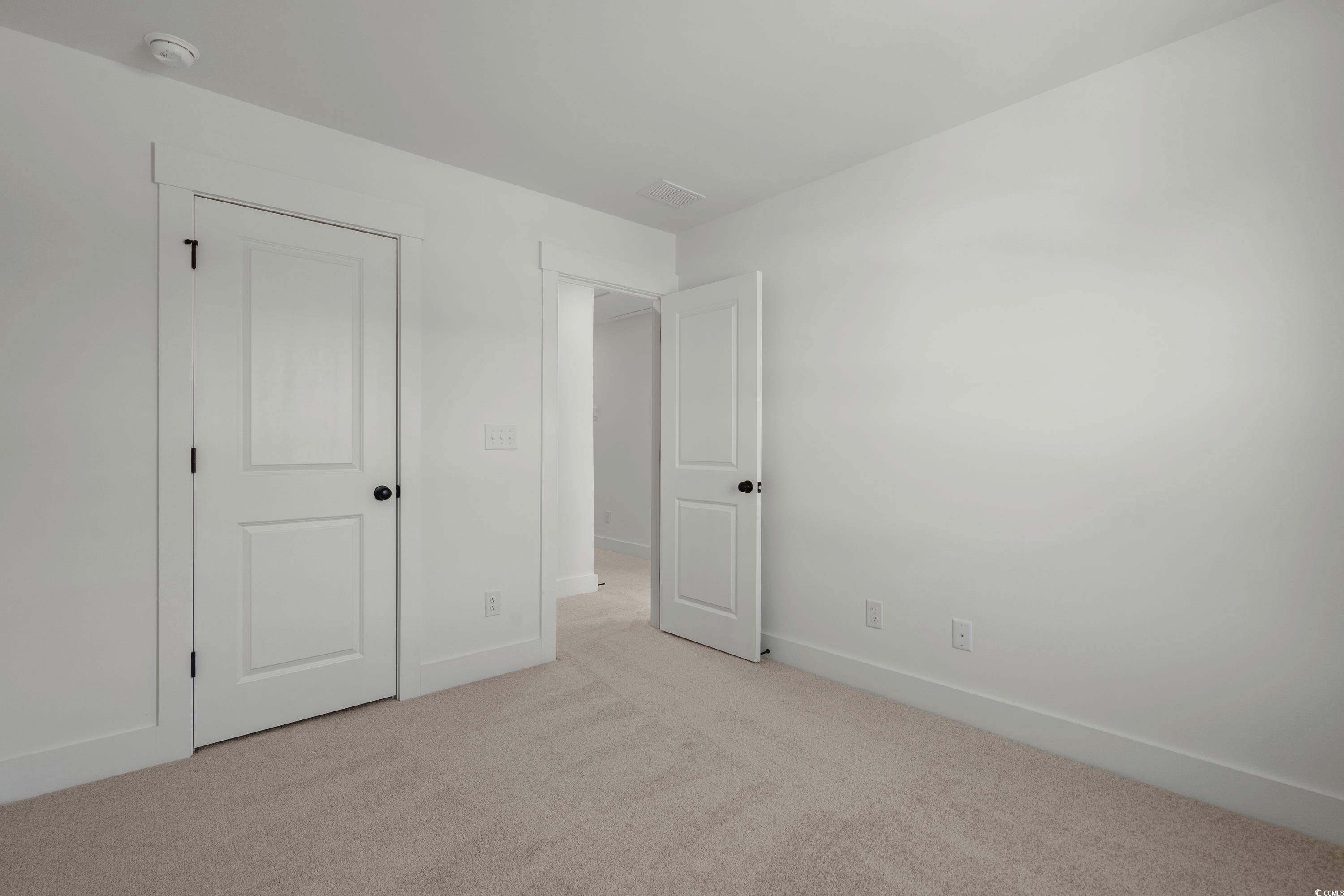 4414 Kingsport Road, Unit 1402 Little River, SC 29566 - Photo 20 of 34 Unfurnished bedroom with carpet and baseboards