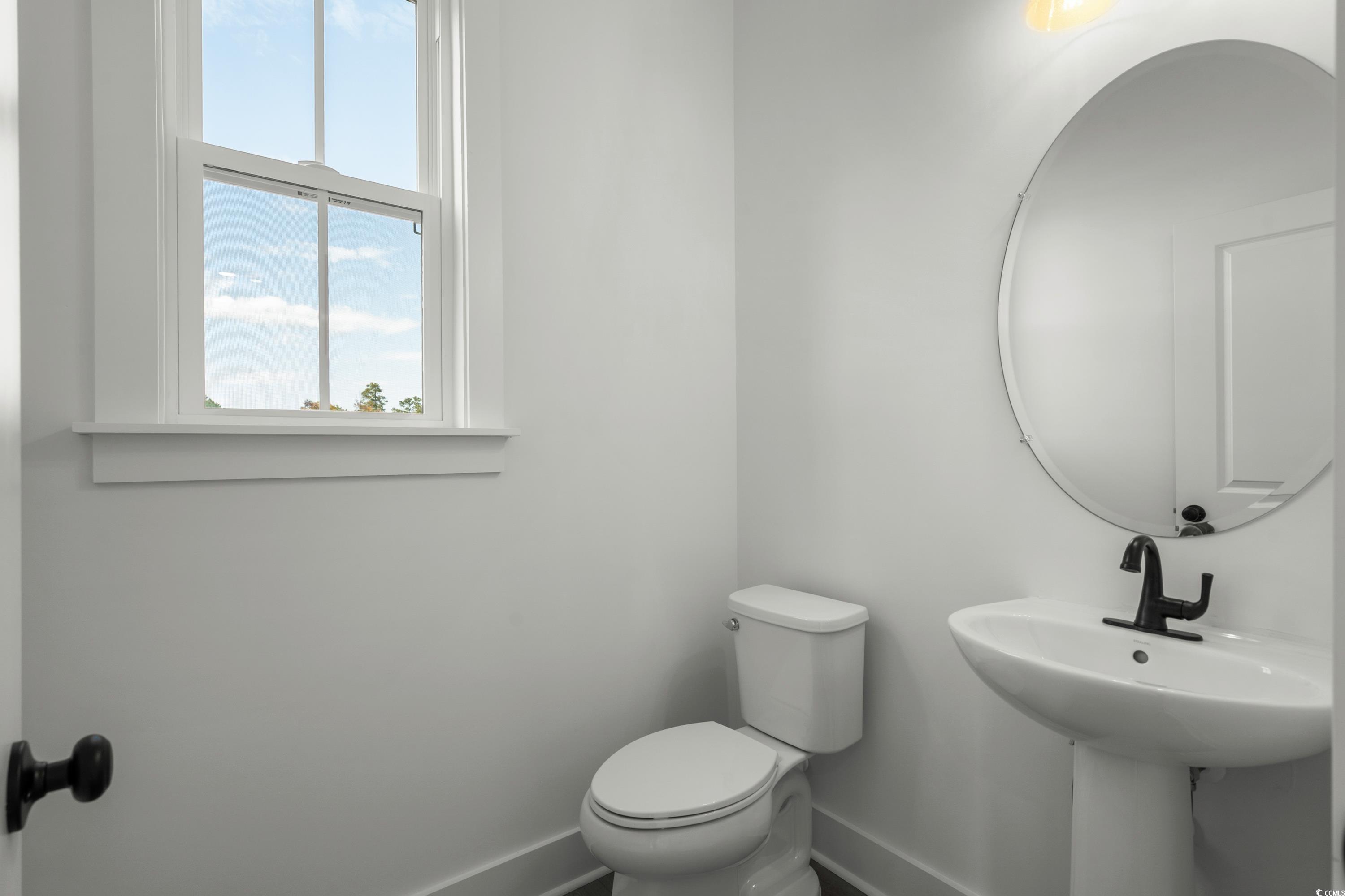 4414 Kingsport Road, Unit 1402 Little River, SC 29566 - Photo 27 of 34 Half bath with baseboards and toilet