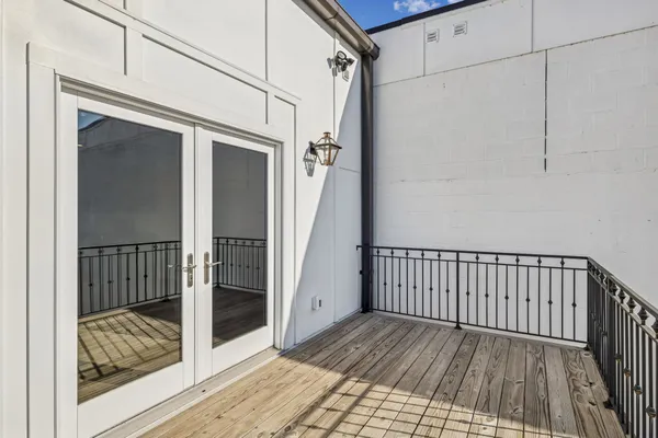 a view of a balcony with wooden floor