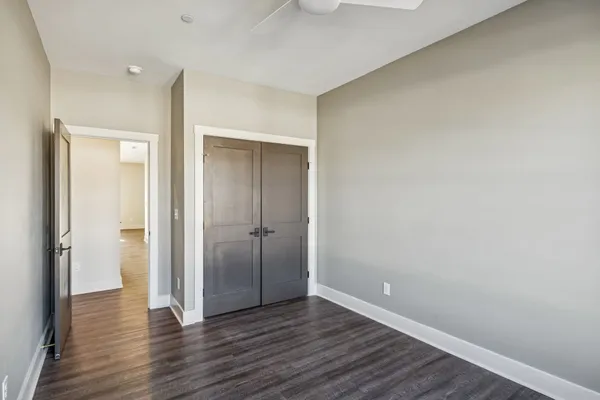 a view of an empty room and wooden floor