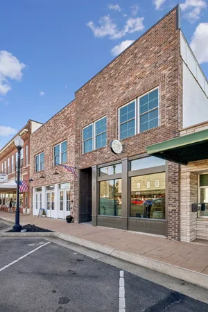 a view of a building with a street