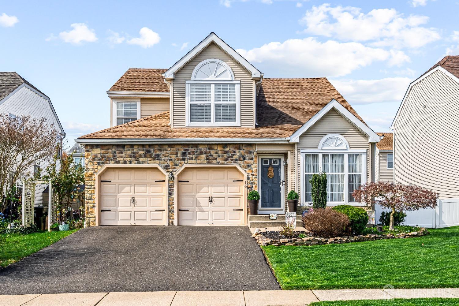 a view of front a house with a yard