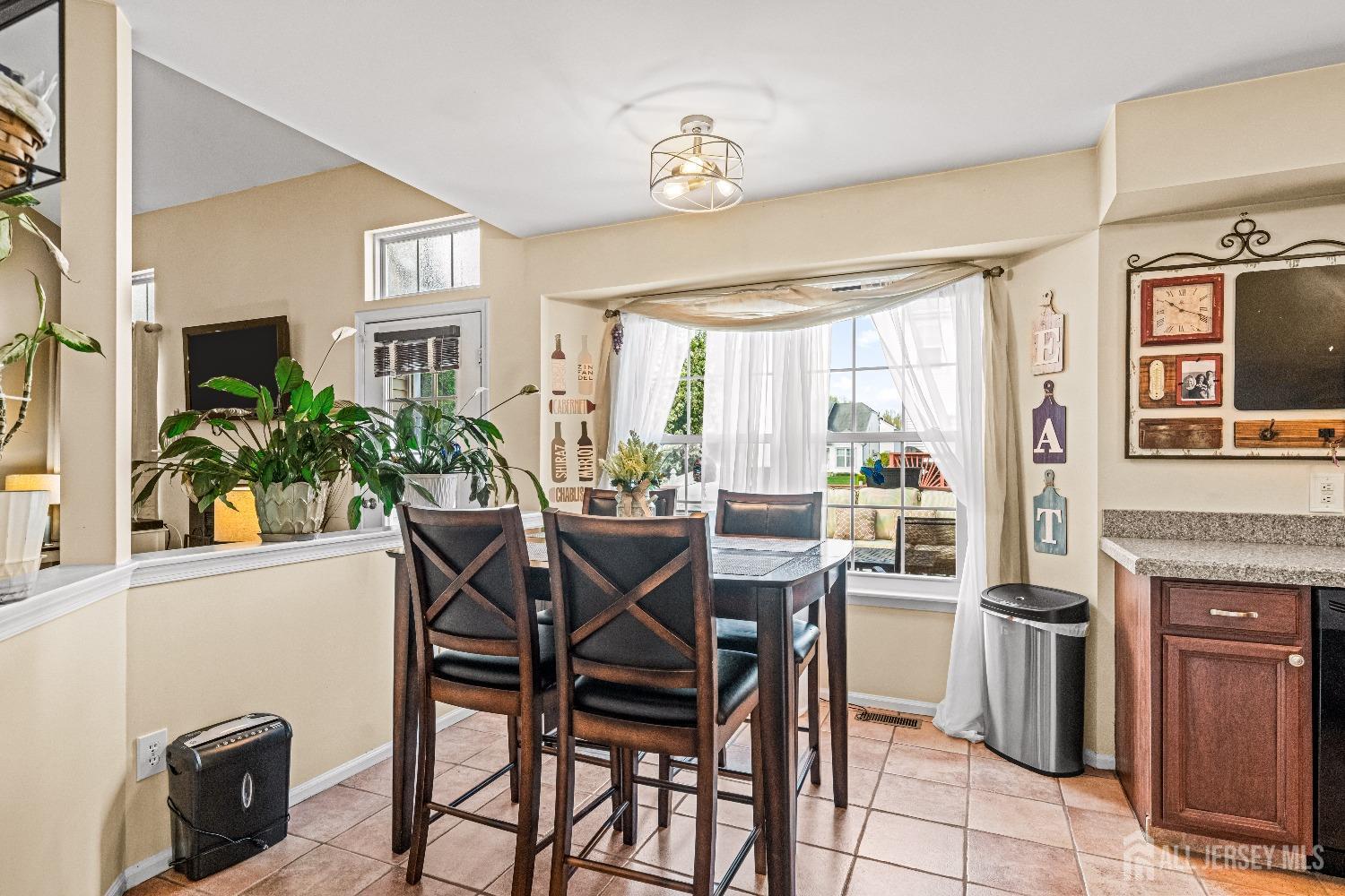 16 Dryden Drive Burlington, NJ 08016 - Photo 13 of 13 a view of a dining room with furniture window and outside view
