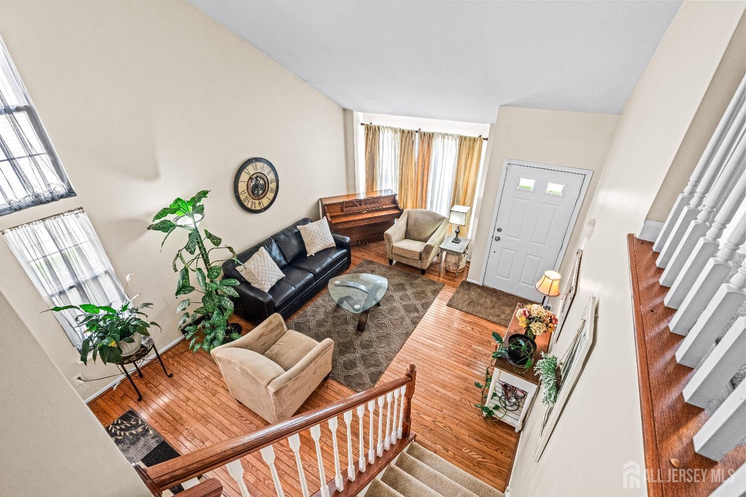 16 Dryden Drive Burlington, NJ 08016 - Photo 10 of 13 a living room with furniture and a clock