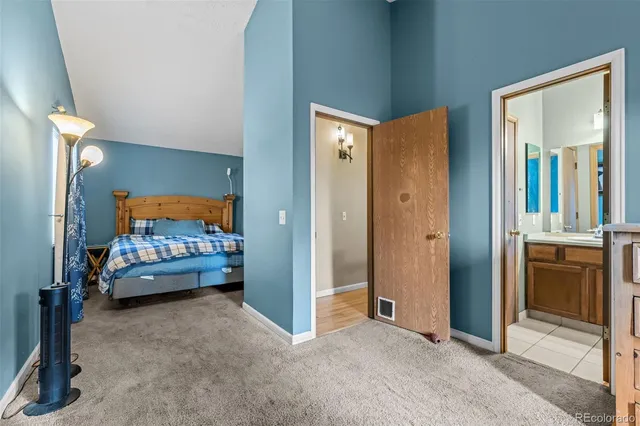 a view of a bedroom with a bed and a dresser