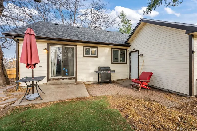 a backyard of a house with seating space
