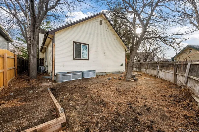 a view of a backyard with large trees