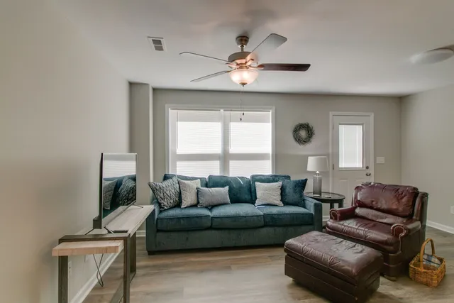 a living room with furniture and a window