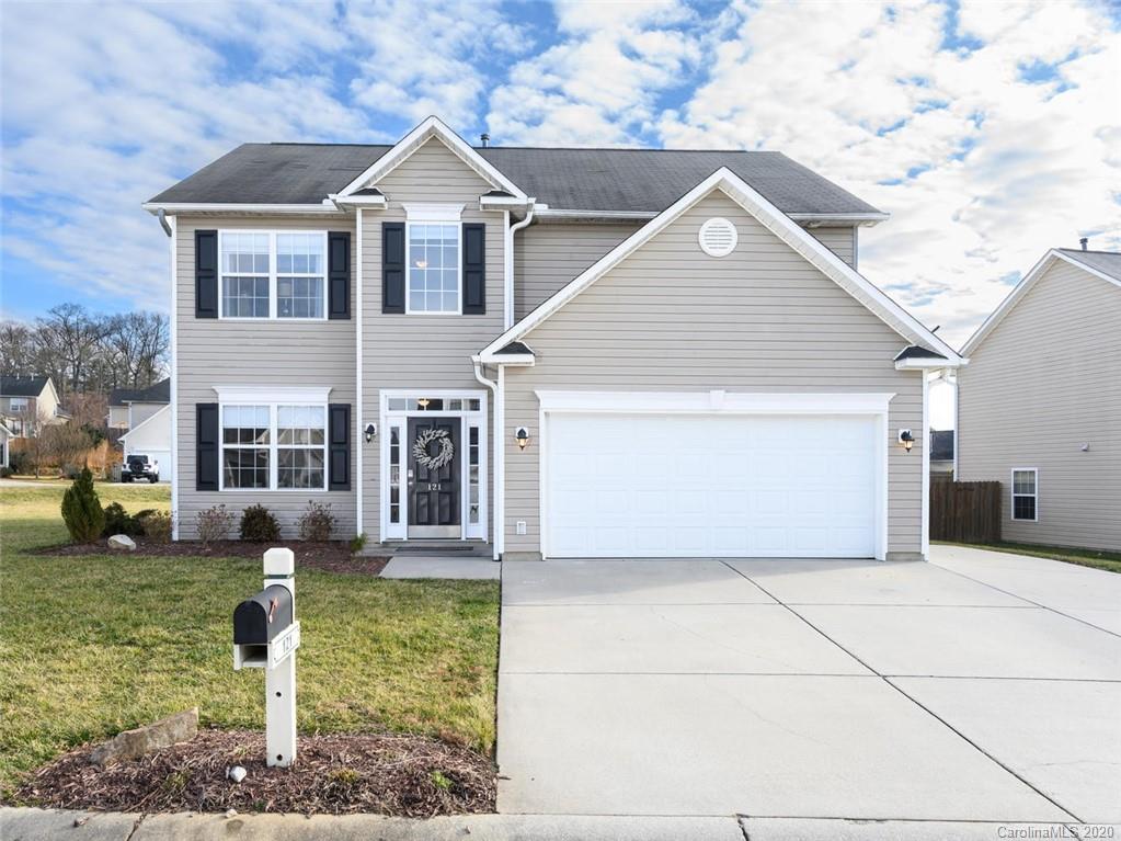 121 Haw River Road Fletcher, NC 28732 - Photo 1 of 42 a front view of a house with garden
