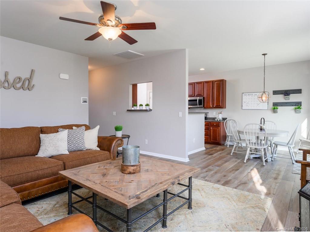 121 Haw River Road Fletcher, NC 28732 - Photo 11 of 42 a living room with furniture and a kitchen area