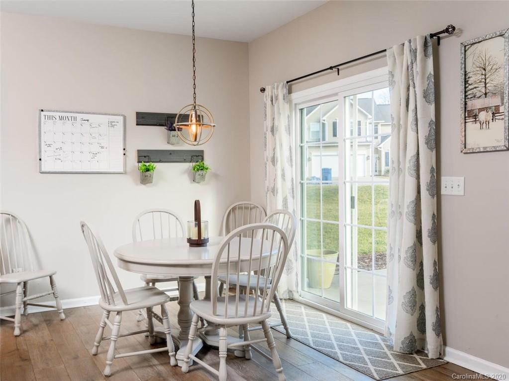 121 Haw River Road Fletcher, NC 28732 - Photo 15 of 42 a view of a dining room with furniture window and outside view