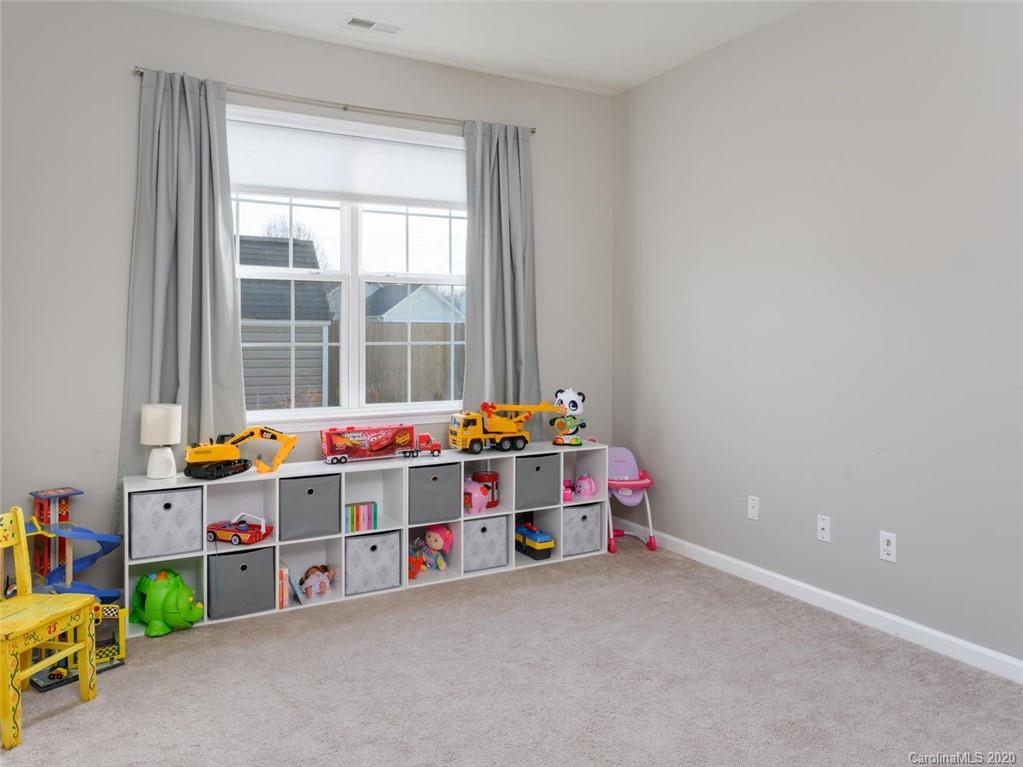 121 Haw River Road Fletcher, NC 28732 - Photo 16 of 42 a room with toys and a table