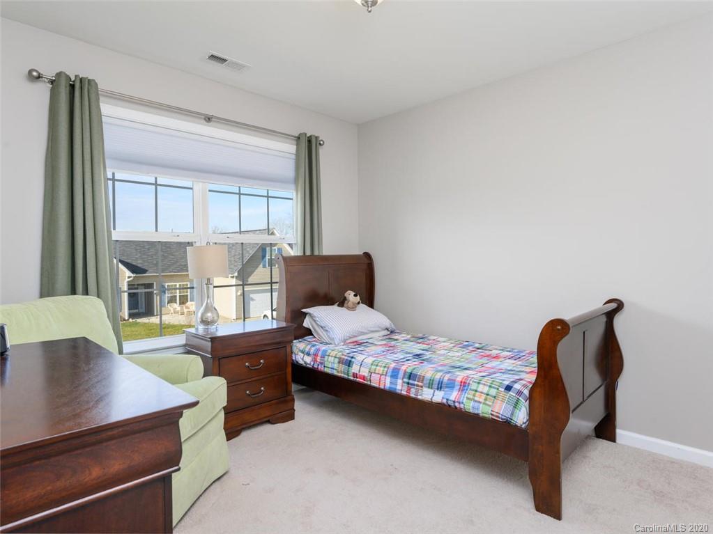 121 Haw River Road Fletcher, NC 28732 - Photo 21 of 42 a bedroom with a bed and a window