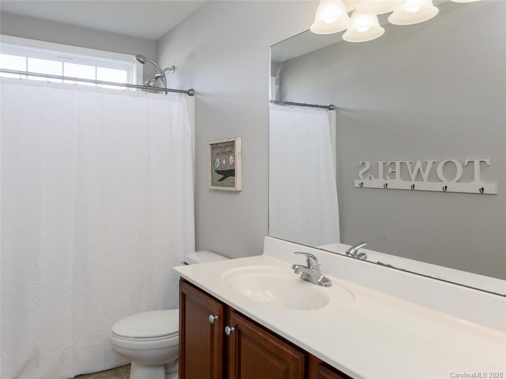 121 Haw River Road Fletcher, NC 28732 - Photo 22 of 42 a bathroom with a sink vanity granite and toilet