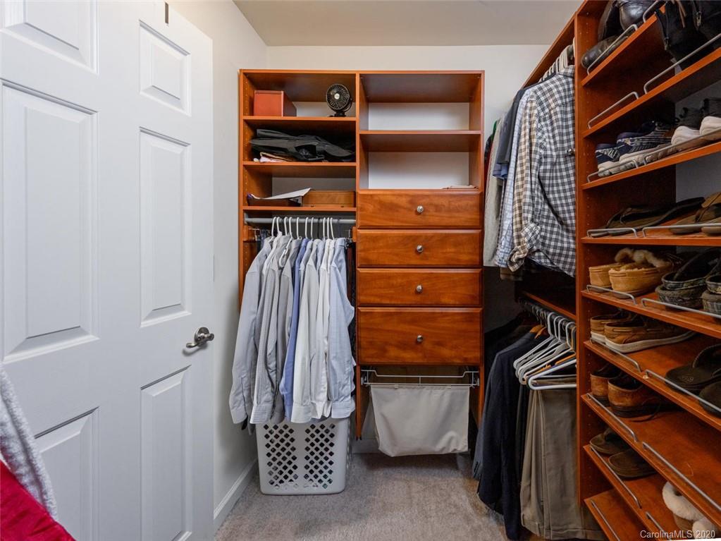 121 Haw River Road Fletcher, NC 28732 - Photo 25 of 42 a view of walk in closet with clothes and shoes