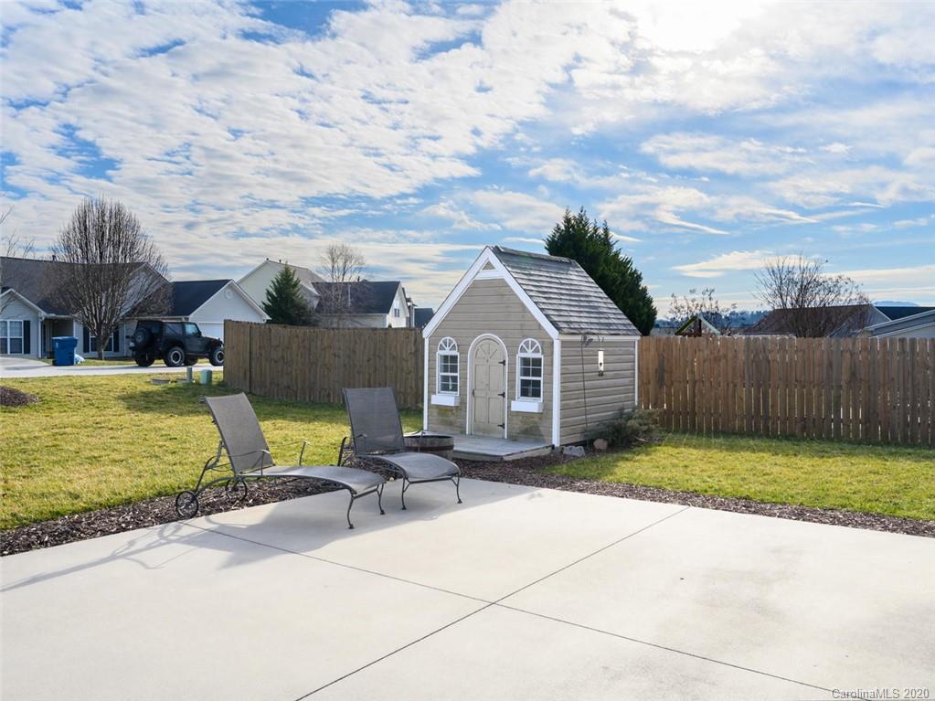 121 Haw River Road Fletcher, NC 28732 - Photo 28 of 42 a front view of a house with garden