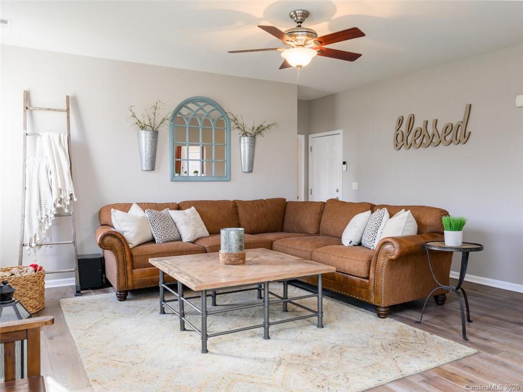 121 Haw River Road Fletcher, NC 28732 - Photo 10 of 42 a living room with furniture and a large window
