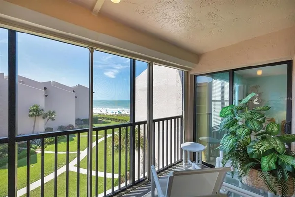 a view of a swimming pool with a yard