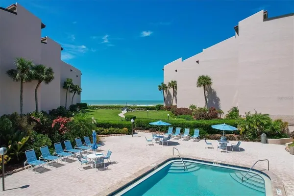 a view of a golf course with a swimming pool