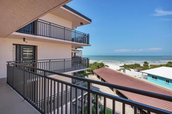 a view of a balcony with an ocean