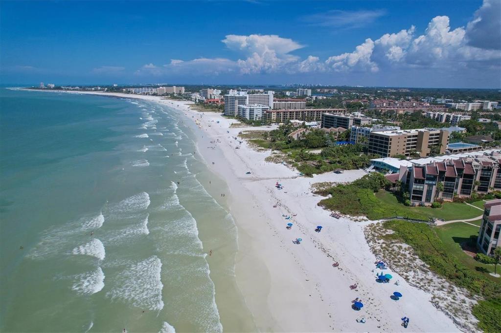 6480 Midnight Pass Road, Unit 506 Sarasota, FL 34242 - Photo 24 of 49 a view of a lake in middle of the town