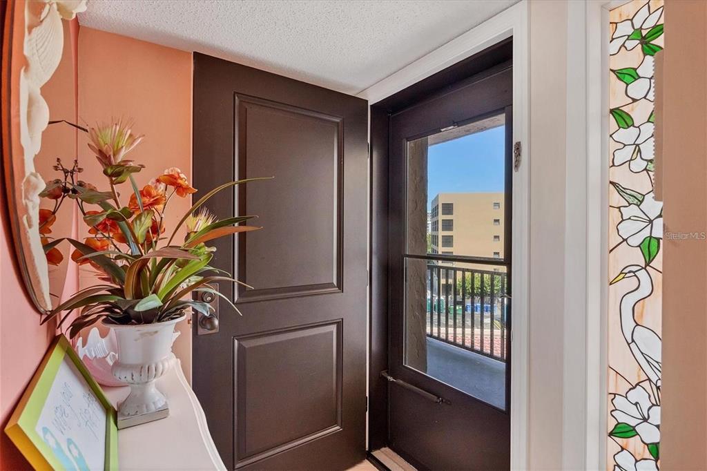 6480 Midnight Pass Road, Unit 506 Sarasota, FL 34242 - Photo 3 of 49 a view of a door and chair