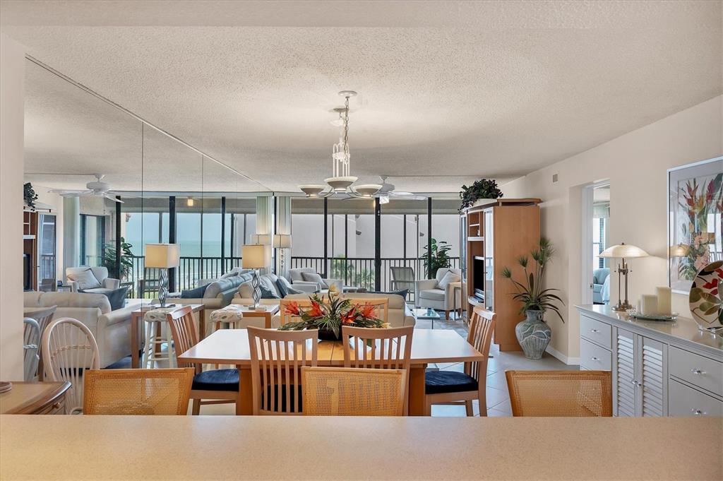 6480 Midnight Pass Road, Unit 506 Sarasota, FL 34242 - Photo 35 of 49 a outdoor living space with furniture and chandelier