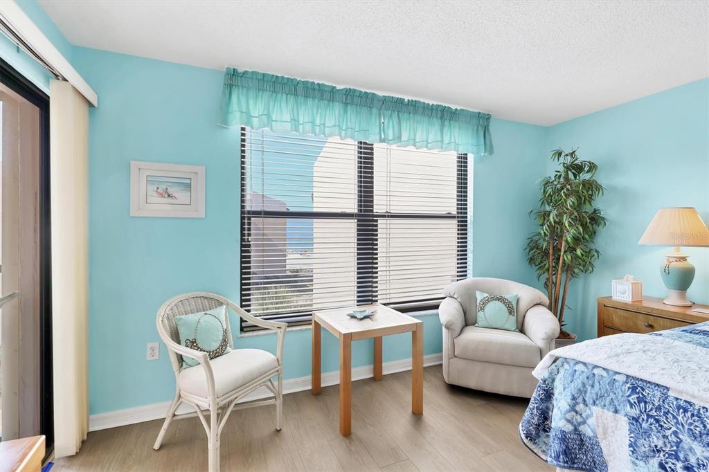 6480 Midnight Pass Road, Unit 506 Sarasota, FL 34242 - Photo 38 of 49 a living room with furniture and a large window