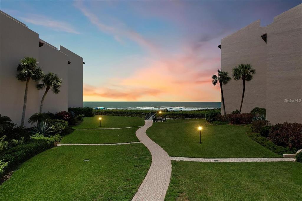 6480 Midnight Pass Road, Unit 506 Sarasota, FL 34242 - Photo 8 of 49 a view of a golf course with a garden