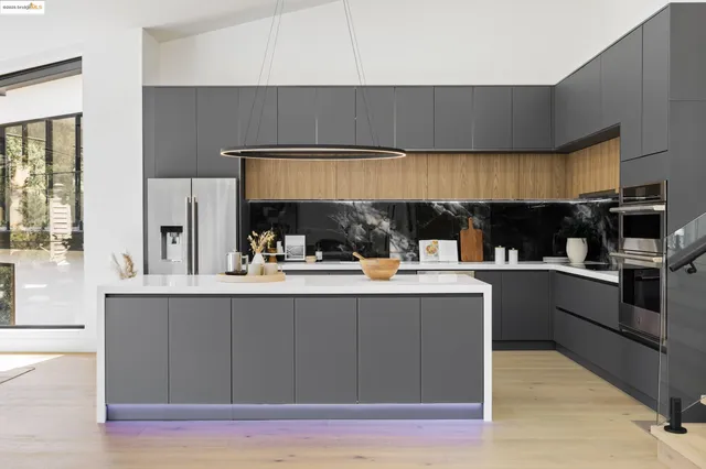 a view of a dining room with furniture large windows and wooden floor