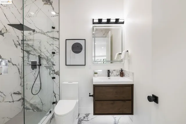 a bedroom with a large window and a dresser