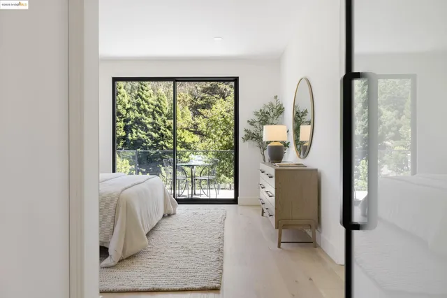a view of a chairs and table in the balcony