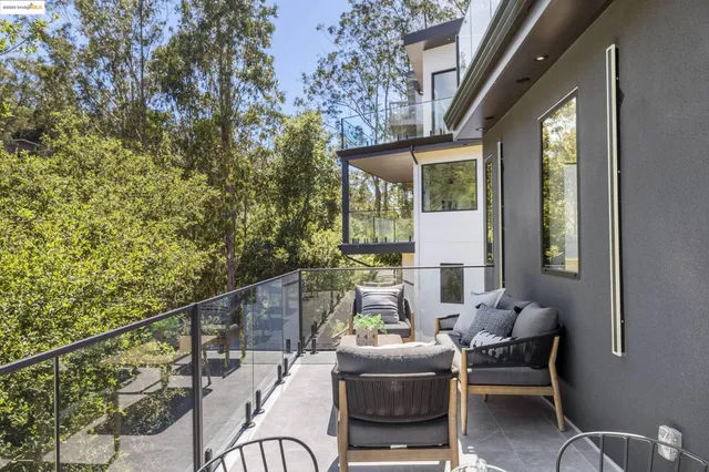 a white bath tub sitting in a bathroom next to a window