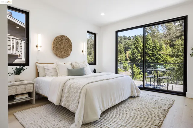 a bathroom with a sink and mirror with bathtub