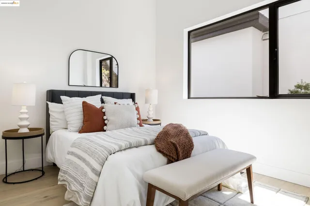 a spacious bathroom with a sink and mirror