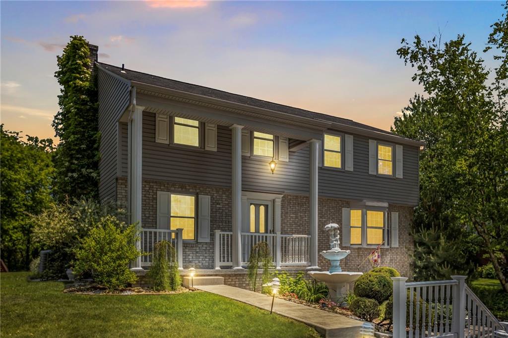 136 Lakeview Drive McKees Rocks, PA 15136 - Photo 1 of 24 a front view of a house with garden