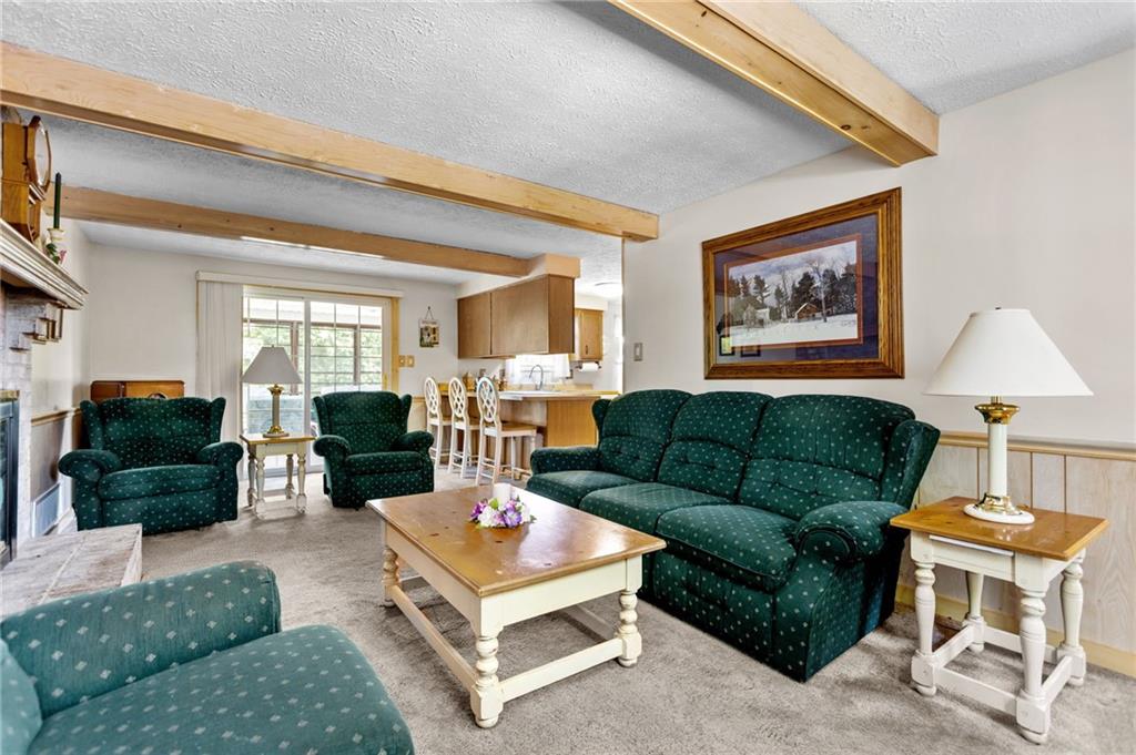 136 Lakeview Drive McKees Rocks, PA 15136 - Photo 11 of 24 a living room with furniture and a fireplace